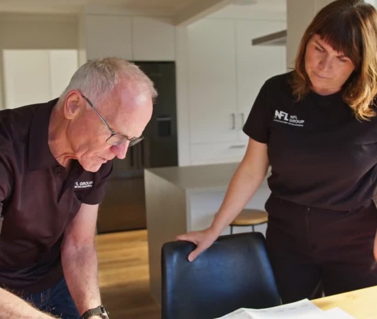 Martin and Helen reviewing project plans together