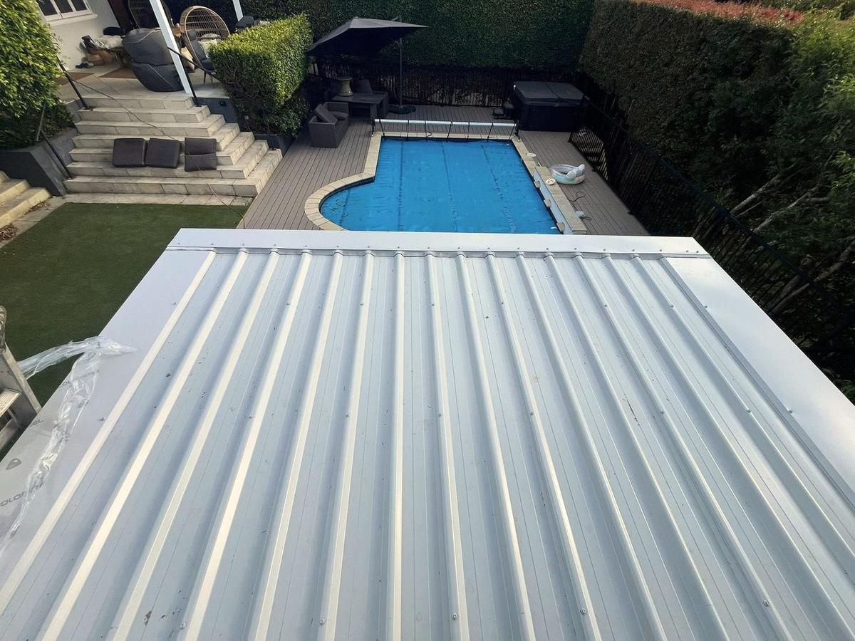 Finished backyard transformation with new deck and garden house